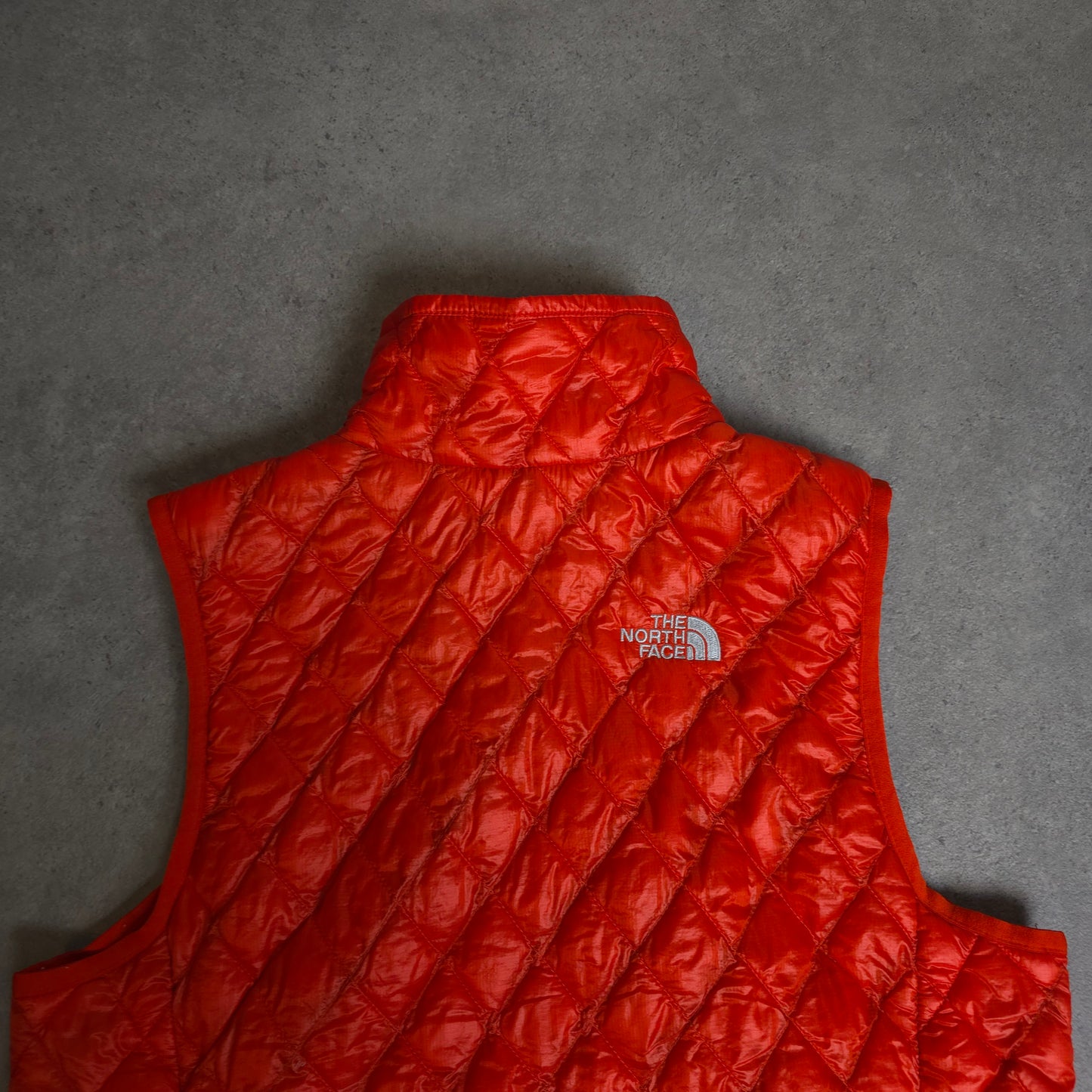 vintage the north face thermoball gilet in orange - women's small