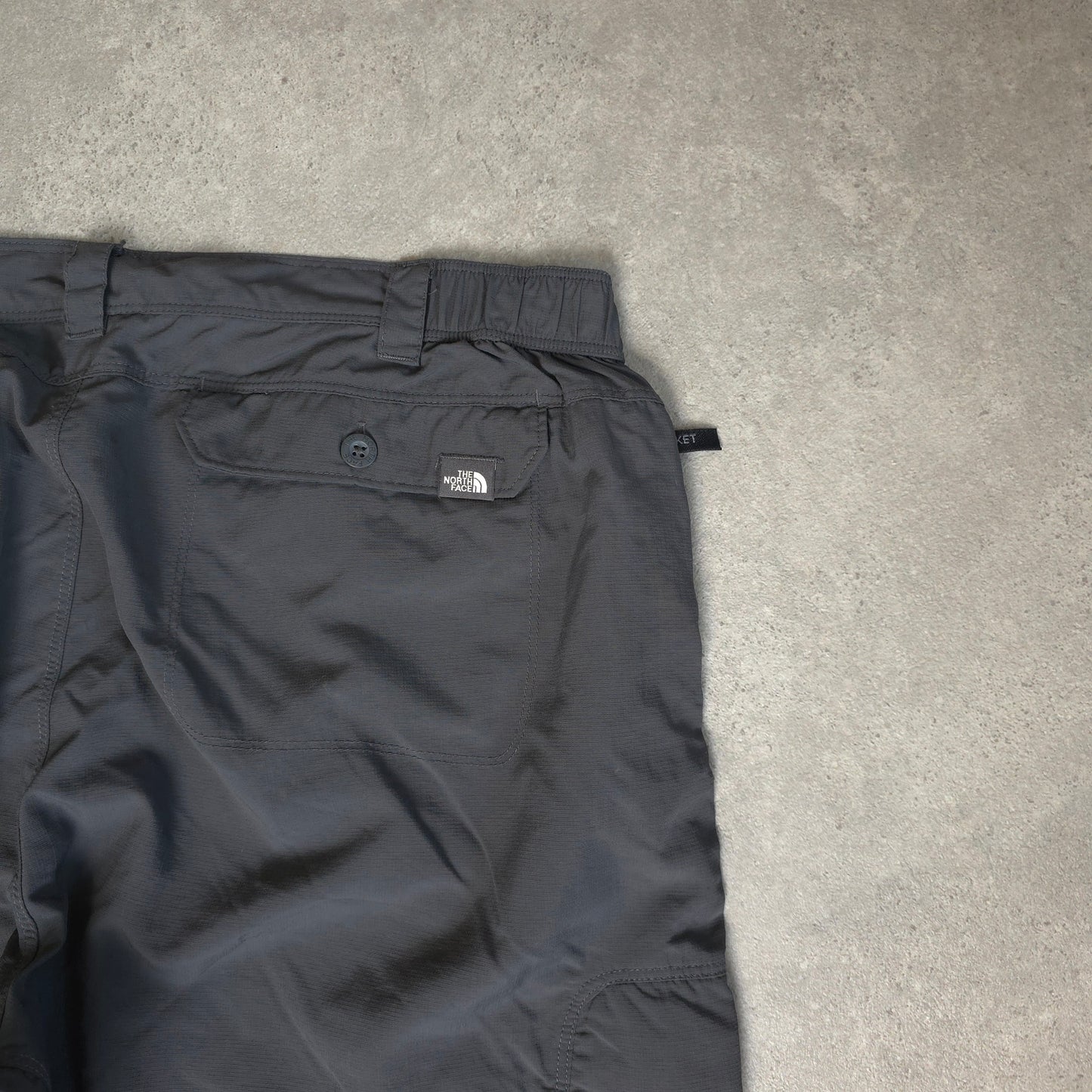The North Face baggy walking trousers with stow pocket in grey - XL