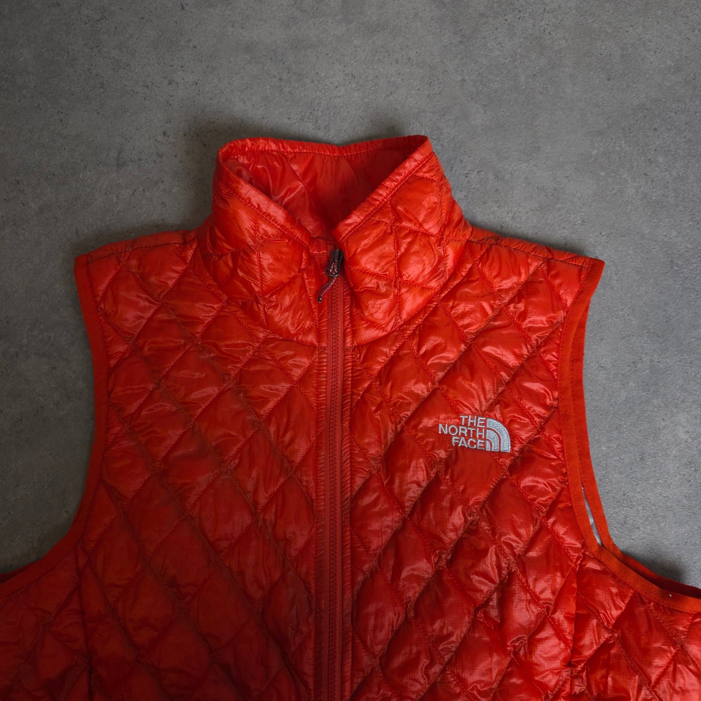 vintage the north face thermoball gilet in orange - women's small