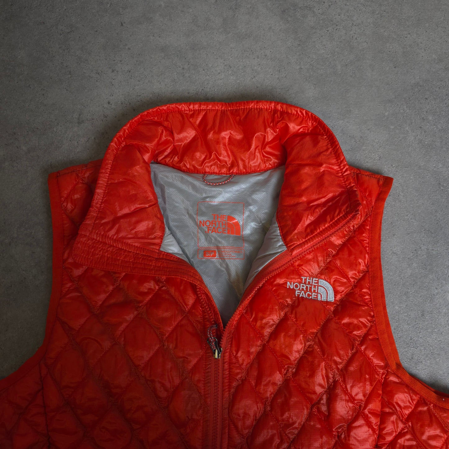vintage the north face thermoball gilet in orange - women's small