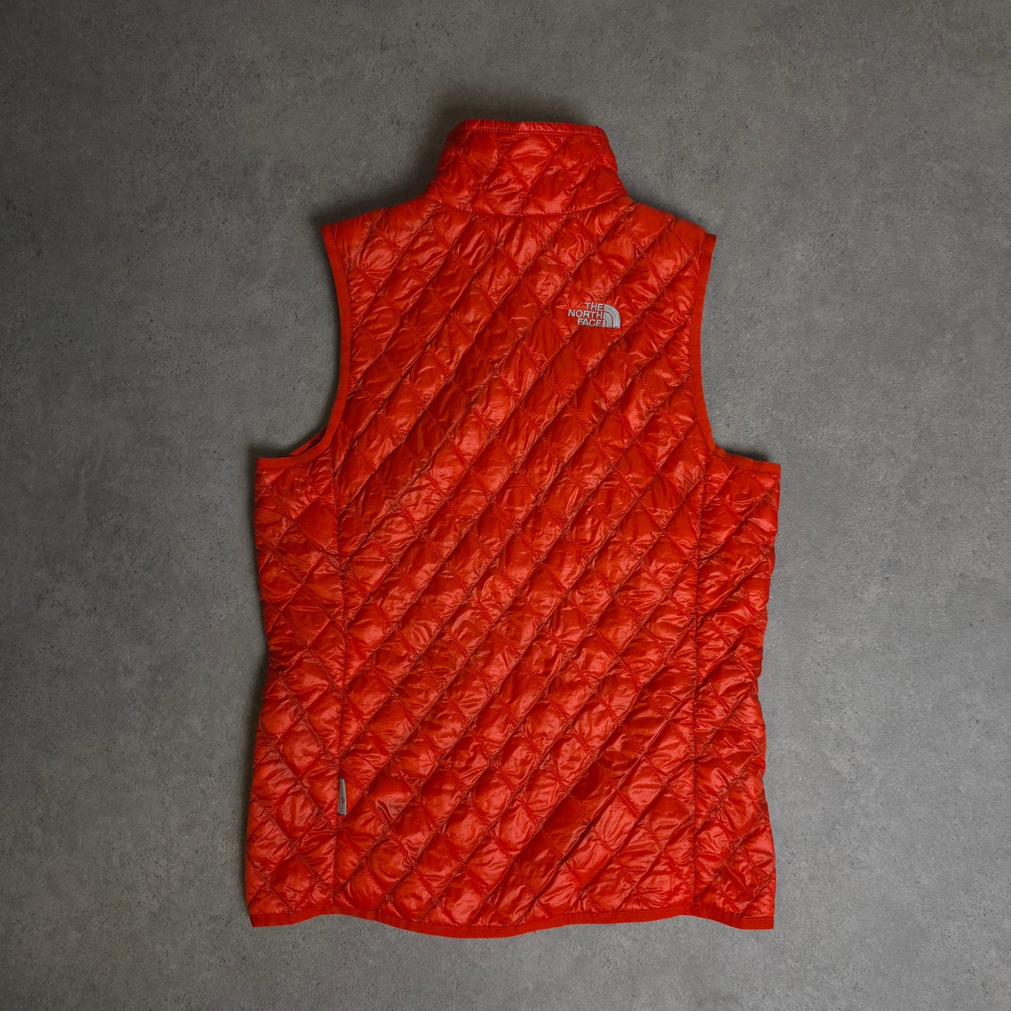 vintage the north face thermoball gilet in orange - women's small