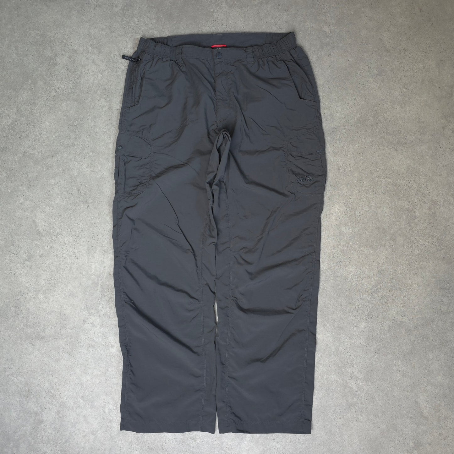 The North Face baggy walking trousers with stow pocket in grey - XL