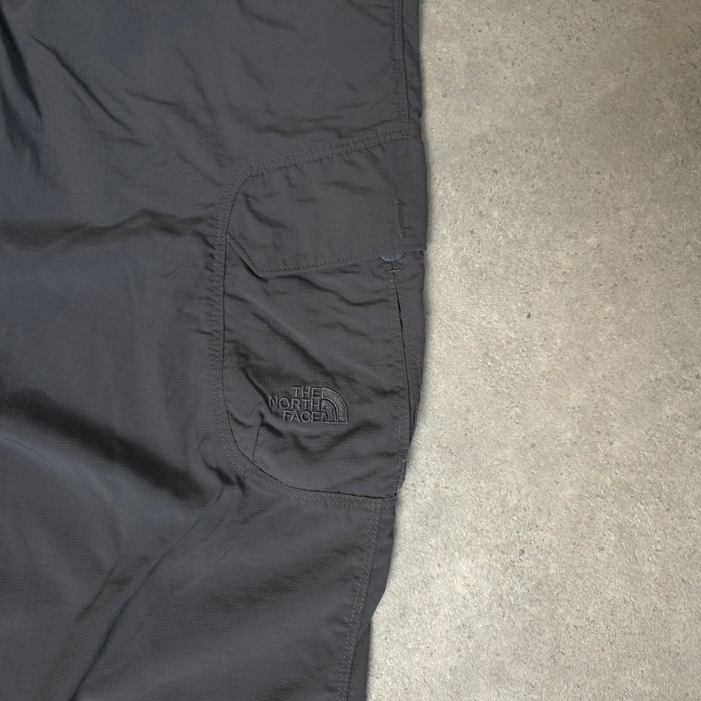 The North Face baggy walking trousers with stow pocket in grey - XL