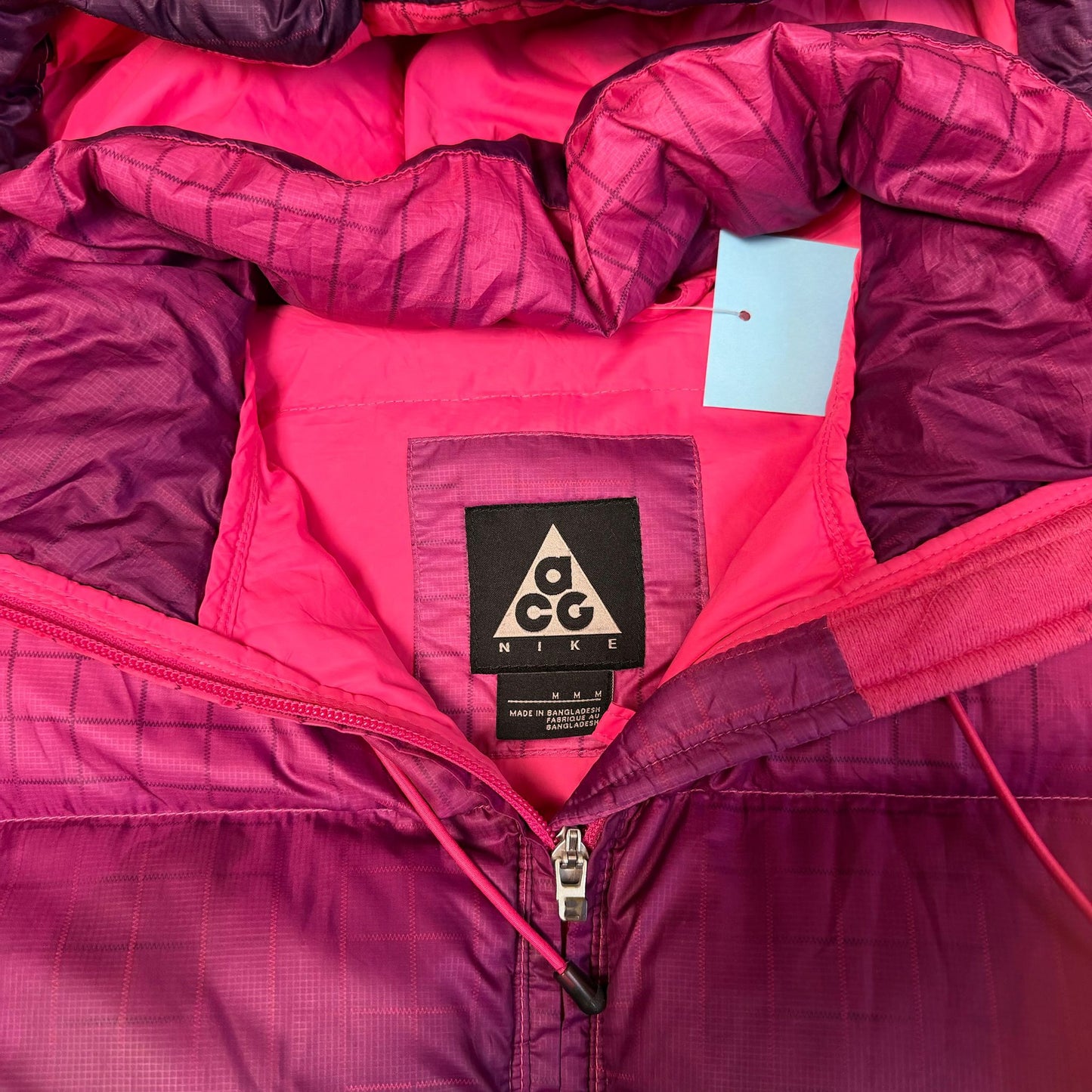 Vintage Nike ACG puffer jacket in pink purple gradient - women's medium